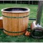 Oval hot tub with outside heater